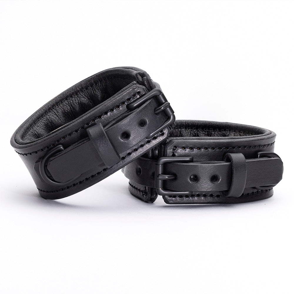 Midnight Padded Cuffs - all black leather bdsm cuffs with limited edition matte black hardware. Handmade by LVX Supply